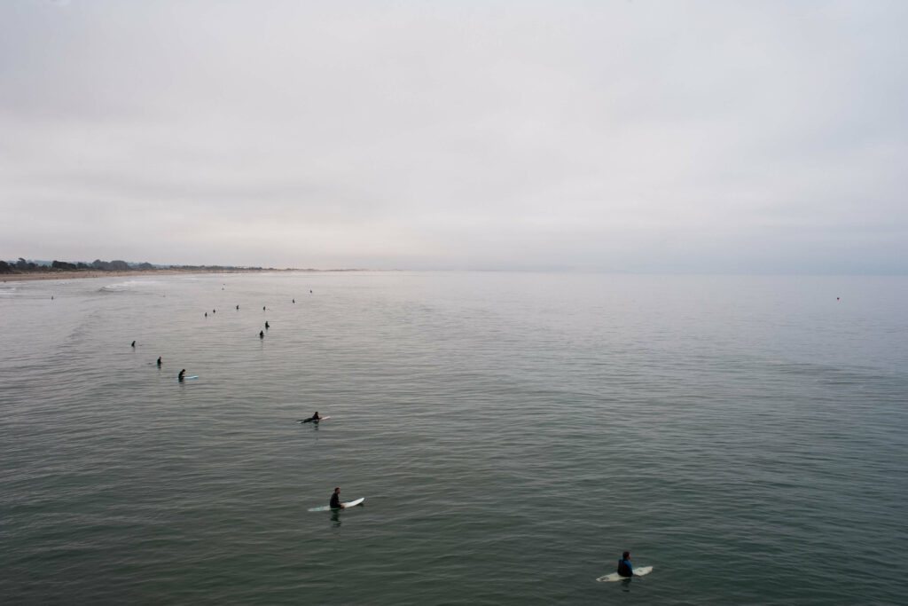A group of beginner surfers waiting for another wave