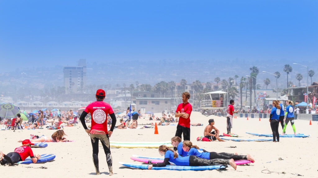 Pacific Surf School instructors teaching students surfing fundamentals