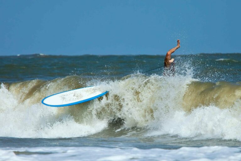 Surfer wiping out in the waves