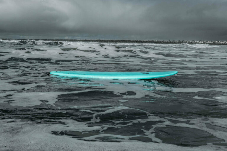 Soft top surfboard floating in the ocean