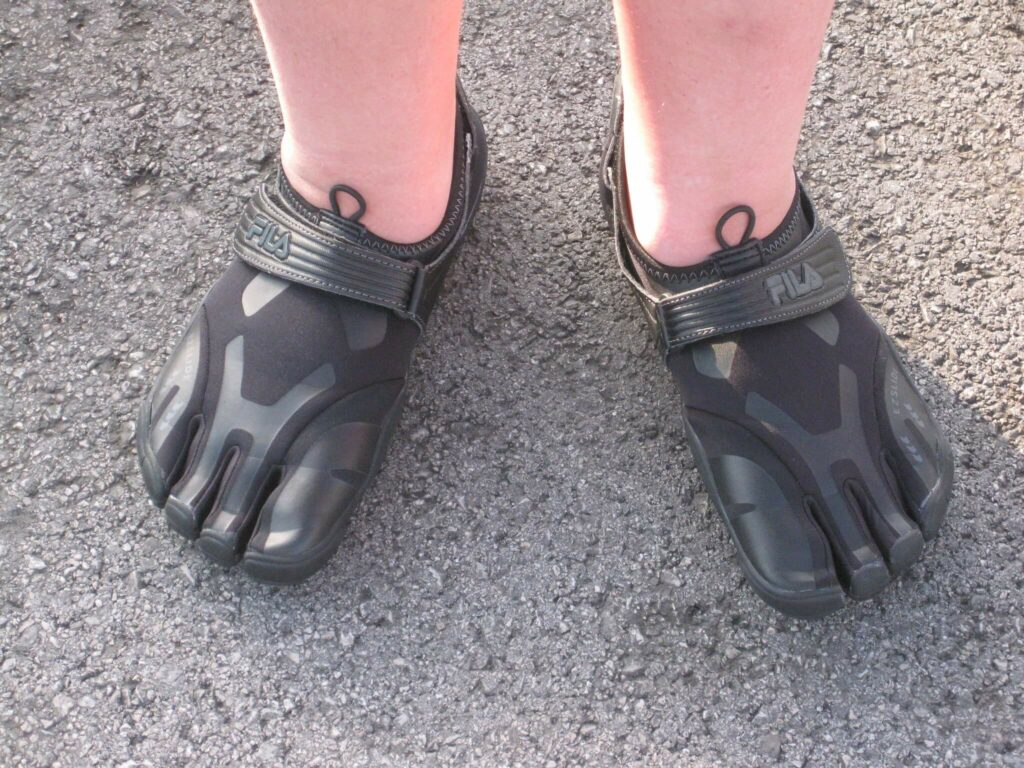 Surfer wearing reef boots