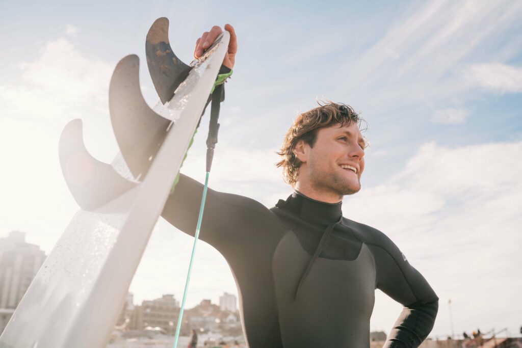 Man ready to surf after getting a surf rental in San Diego.