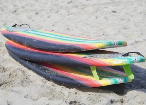 3 surfboards on the sand ready to rent