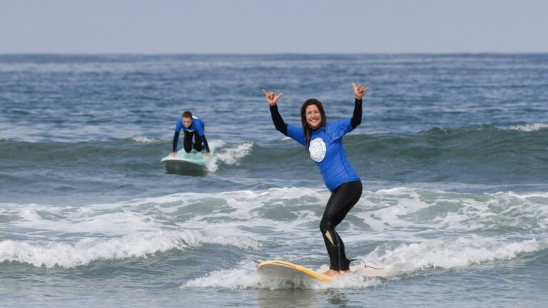 Women and boy professional surfer, surfing