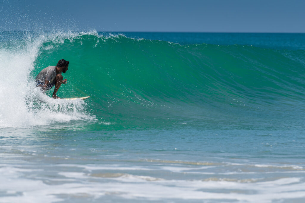 Surfer getting tubed